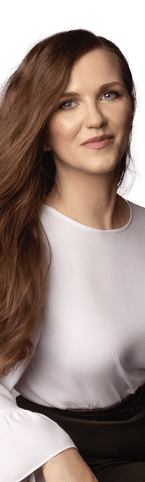 A woman with long hair wearing a beige blouse