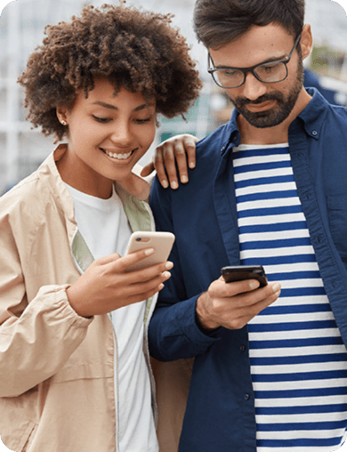 A woman and man using their mobile phones