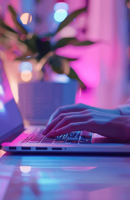 A woman is writing message on her laptop