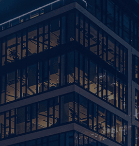 A glass office building in the evening