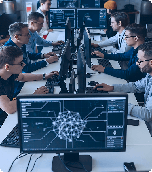 two rows of developers looking at their monitors