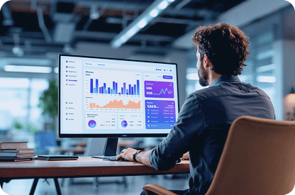 A developer who is looking at charts on the monitor
