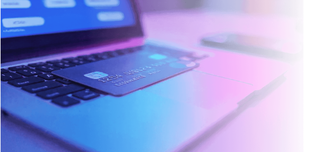 Payment card on laptop keyboard for self-service banking