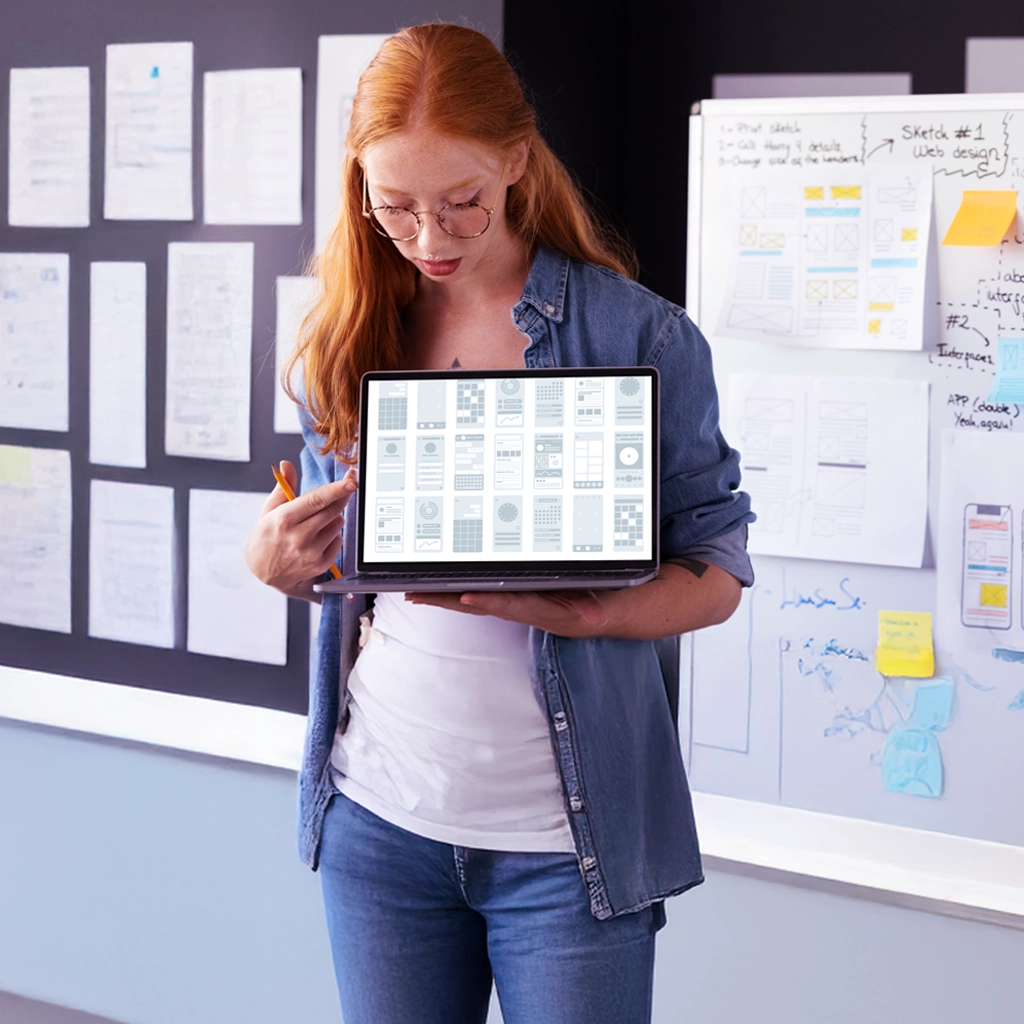 a woman holding a tablet with nearshore mobile app development options