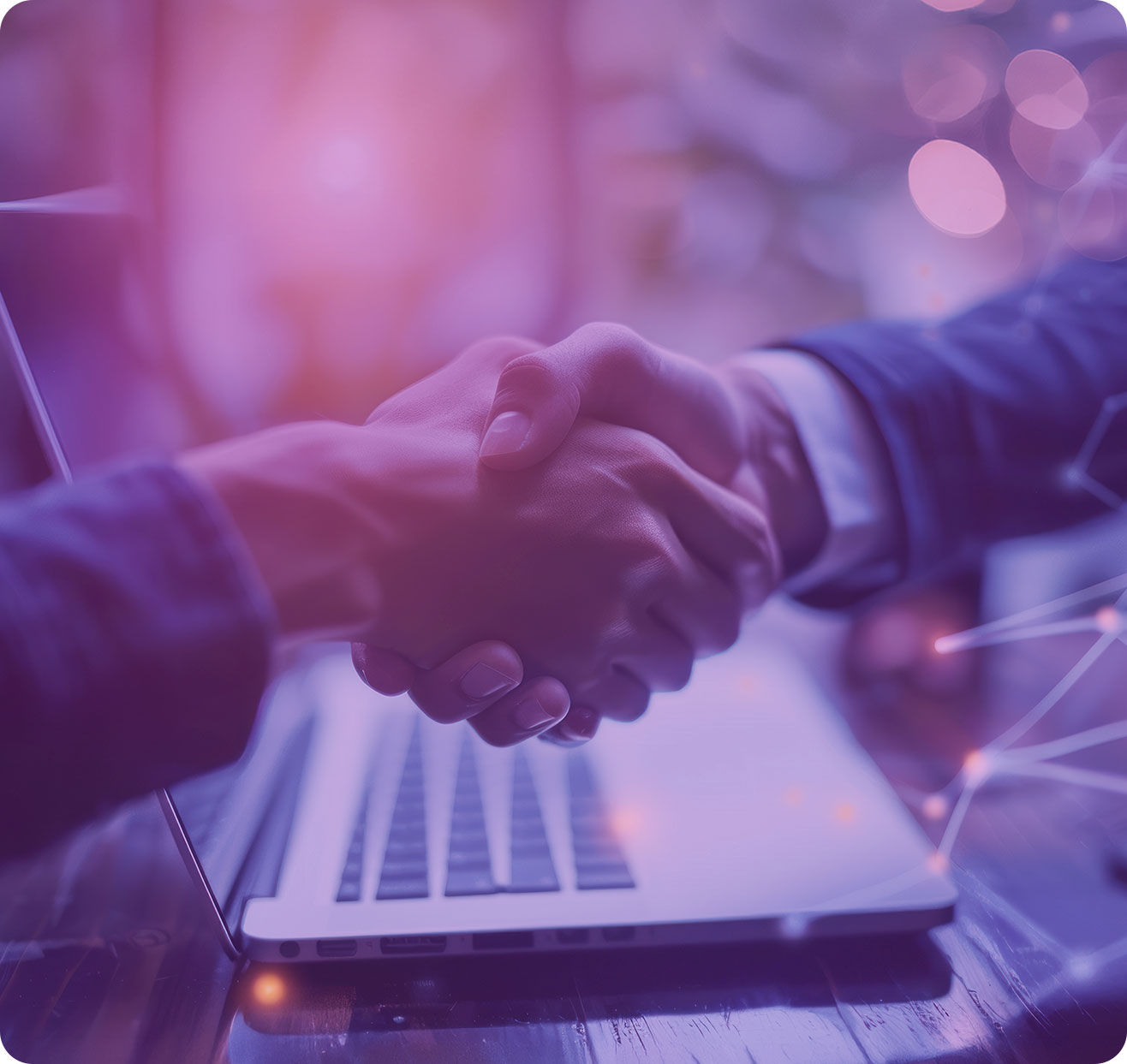 handshake over laptop