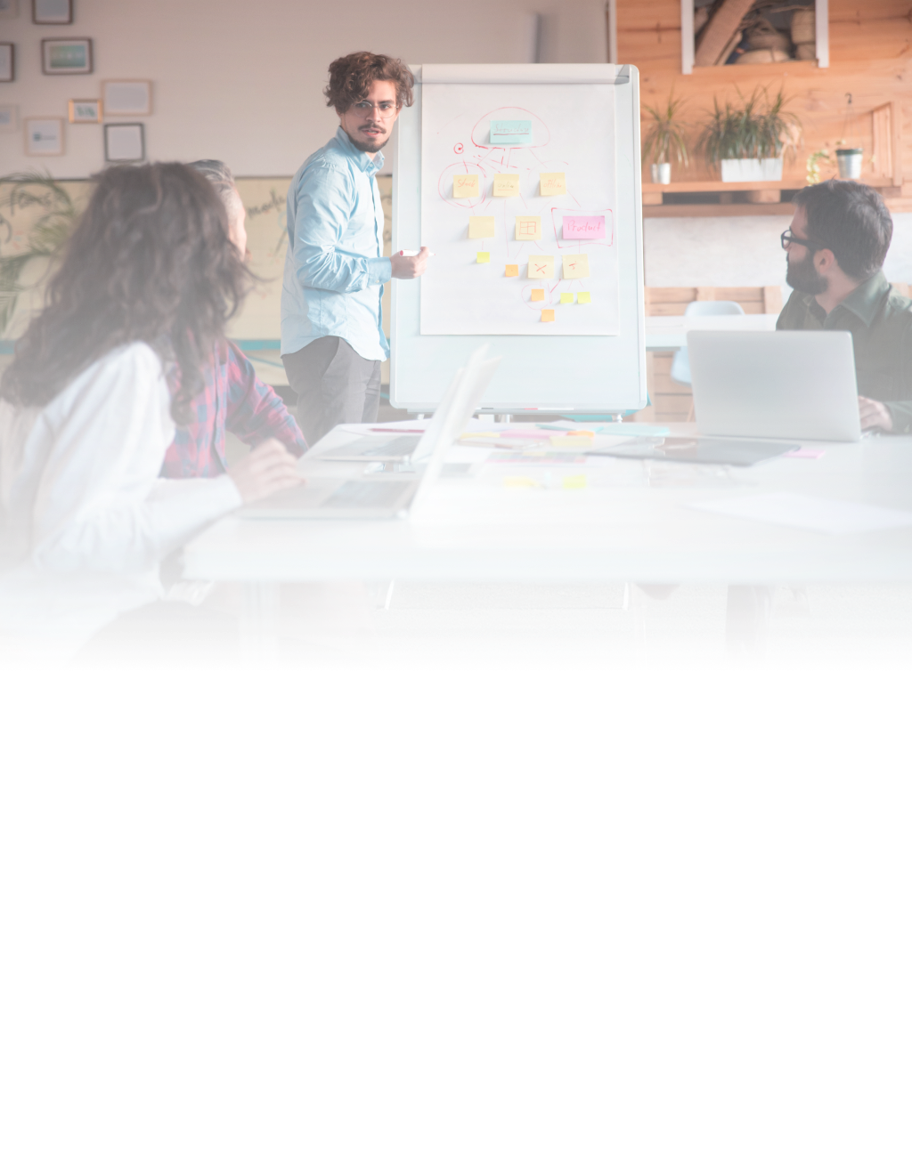 A man discussing custom software development for startups with his team